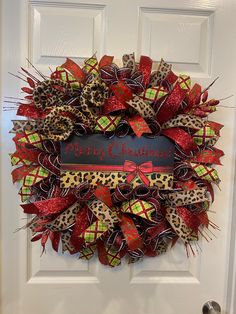 a leopard print christmas wreath on a door