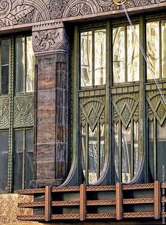 an old building with ornate windows and wooden steps