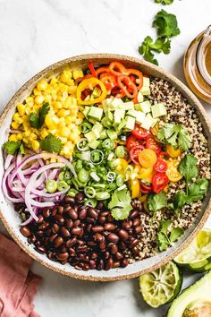 a bowl filled with beans, avocado and other vegetables