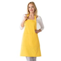 a woman in an apron is posing for the camera