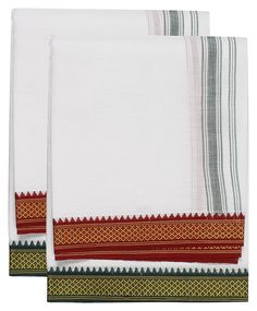 two white towels with red and green trims