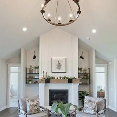 a living room filled with furniture and a fire place in the middle of a room