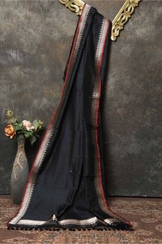 Buy beautiful black Banarasi dupatta online in USA. Add a perfect festive touch to your Indian suits with exquisite Banarasi dupattas, phulkari dupattas, embroidered dupatta, bandhej dupatta, printed dupatta from Pure Elegance Indian saree store in USA.-full view Unstitched Black Churidar With Cutdana Details, Black Churidar With Cutdana For Festive Occasion, Black Cutdana Churidar For Festive Occasions, Black Cutdana Churidar For Eid, Festive Black Anarkali Set With Cutdana, Traditional Black Churidar With Cutdana, Black Cotton Silk Salwar Kameez For Eid, Black Cotton Silk Saree For Diwali, Unstitched Black Cotton Silk Saree