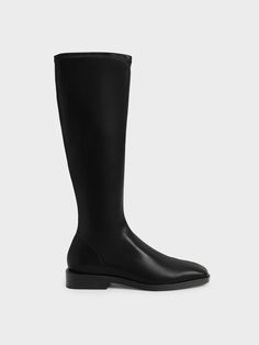 It is never too late to get yourself a pair of knee-high boots, and these could be the one for you. With their sleek black colour, you can trust them to quietly slot into any ensemble to boost your style without disrupting what you already have going on. Plus, the square toe design is easy on the eyes and the 2.5cm low heel is perfect for all-day walks. For an elegant ensemble, style them with a shirt dress and a saddle bag. Knee High Flat Boots, Knee High Boots Outfit, Black Flat Boots, Knee High Boots Flat, High Boots Outfit, Faux Leather Heels, Black Knees, Charles Keith, Never Too Late