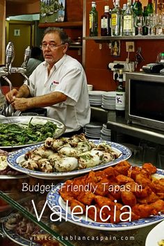 a man standing in front of a counter filled with plates and bowls full of food