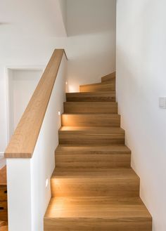 the stairs are made of wood and have lights on each step to illuminate them