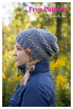 a woman wearing a gray knitted hat with braids in front of yellow flowers