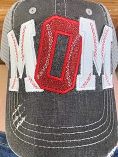 a baseball cap with the word mom on it