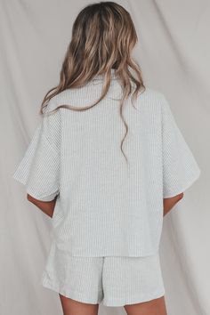 Looking for the perfect boat day attire? Look no further than this lightweight button up top. Pairs perfectly with our Having A Boat Day Striped Shorts. Blue and white boxy vertical stripe button down Material is Linen Hang to dry Model is 5'9 wearing a small SHOP THE LOOK Small Medium Large Length 23.5” 24.5” 25.5” Bust 22” 23” 24” Relaxed Fit Vertical Stripes Top For Vacation, Vertical Stripes Relaxed Fit Top For Day Out, Vertical Stripes Tops With Relaxed Fit For Vacation, Relaxed Fit Vertical Stripes Top For Day Out, Relaxed Fit Vertical Stripe Tops For Day Out, Casual Vacation Top With Striped Collar, Striped Button-up Tops For Loungewear, Casual Top With Striped Collar For Vacation, Casual Tops With Striped Collar For Vacation