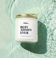 a jar of best admin ever sits in the water next to a wave pool