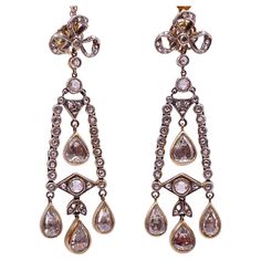 An absolutely superb pair of rose-cut diamonds earrings from 1920s ( Artdeco ) . These incredible earrings are crafted in 14k gold and feature a sparkling array of rose cut Diamond . Approximately 5.00 carats , in which are 8 pieces of 0.50 carat and 1.00 carat set in smaller pieces on this beautiful piece. Formal Rose Cut Diamond Chandelier Earrings, Formal Chandelier Earrings With Rose Cut Diamonds, Vintage Yellow Gold Diamond Earrings With Rose Cut, Vintage Rose Cut Diamond Earrings, Pear-shaped Rose Cut Diamond Earrings For Wedding, Vintage Gold Diamond Earrings With Rose Cut, Vintage Rose Cut Diamond Earrings For Formal Occasions, Rose Cut Diamond Chandelier Earrings, Victorian Gold Diamond Earrings With Single Cut Diamonds