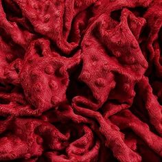 the red fabric is very soft and has been made from an animal's fur