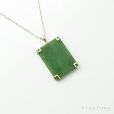 "AAA Siberian Nephrite Jade Necklace - Emerald Green Nephrite Jade - Rectangular Pendant - Statement Necklace - 18kt Yellow Gold Modern with a touch of art deco, this natural untreated Siberian nephrite jade will make the perfect 35th anniversary gift. - - - - - - - - - - - - - - - - - - - - - - - - - - - - - - - - - - - Stone: Siberian Nephrite Jade Size: 40mm length x 30mm width x 6.5mm thick Setting: 18kt Solid Yellow Gold, 8\" chain 100% genuine jade. We work with nephrite jade in its natura Elegant Rectangular Jade Necklace, Rectangular Jade Gemstone Necklaces, Rectangular Jade Gemstone Necklace, Formal Yellow Gold Jade Necklace, Rectangular Green Gemstone Jewelry, Polished Yellow Gold Jade Jewelry, Classic Green Necklace With Rectangular Pendant, Formal Rectangular Jade Jewelry, Elegant Green Rectangular Necklaces