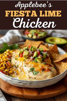 an appetizer's fiesta lime chicken on a plate with tortilla chips and avocado