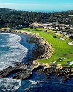 an aerial view of a golf course near the ocean