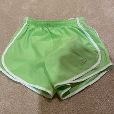 Womens Nike Lime Green Shorts Green Stretch Nike Bottoms, Green Nike Athletic Stretch Shorts, Nike Shorts For Spring, Nike Green Stretch Athletic Shorts, Nike Athletic Shorts For Spring, Nike Athleisure Shorts For Spring, Nike Bottoms For Beach And Spring Season, Nike Green Short Bottoms, Nike Green Short Length Bottoms