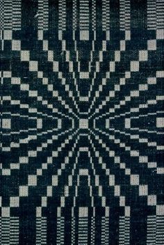 a black and white rug with squares on it