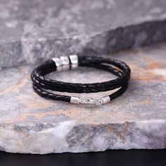 Discover the ideal gift for the special men in your life with our Custom Men's Leather Bracelet. Crafted from genuine leather and elegantly personalized with names in silver, this custom gift is designed for fathers, husbands, and cherished individuals. Whether you're celebrating a birthday or anniversary, our personalized bracelet is the perfect choice to add a unique and heartfelt touch to the occasion. Genuine Leather Charms & Clasp : 925 Sterling Silver Hand personalized Personalized Black Leather Bracelet, Personalized Modern Black Leather Bracelet, Masculine Leather Bracelet For Father's Day, Father's Day Silver Leather Bracelet, Personalized Black Leather Bracelet For Father's Day, Leather Charms, Men's Leather Bracelet, Man Bracelet, Hard Metal