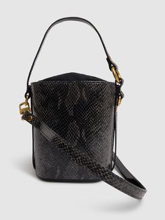 Height: 16cm Width: 14cm Depth: 7cm. Single top handle. Detachable shoulder strap. Drawstring closure. Logo detail The Vivienne, Leather Bucket Bag, Leather Bucket, In Depth, Vivienne Westwood, Embossed Leather, Emboss, Top Handle, Bucket Bag