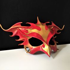 DESCRIPTIONRise from the ashes and transform anew wearing this gorgeous red & gold leather Phoenix Mask. This firebird piece is perfect for Carnivale or Bird CosPlay! Quality leather bird mask, fantastic for Carnivale or Mardi Gras costume. Any color. Waterproofed leather, glossy or matte finish, & several choices to affix the mask (cord, elastic, ribbon, waterproof cord). Measurements: 10" high x 14" wide (tallest & widest points); 10" high between the eyes; 3" wide x 1.5" tall eye Red Fantasy Masks And Prosthetics For Events, Red Fantasy Style Masks And Prosthetics For Events, Red Fantasy Style Masks And Prosthetics For Fantasy Events, Red Fantasy Masks And Prosthetics For Fantasy Events, Red Masks And Prosthetics For Cosplay, Red Fantasy Masks And Prosthetics For Costumes, Fantasy Red Masks And Prosthetics For Costume Events, Fantasy Red Masks And Prosthetics For Costumes, Red Fantasy Masquerade Mask For Costume Party