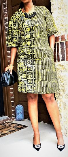 This lovely, A-Line dress in vibrant yellow and black will make you the life of any party ! The fabric is Nigerian Adiré which is hand-designed by local artisans in small batches using a wax-resist technique of fabric dyeing called batik.. This dress is lined and comes with pockets. NOTE: Color and pattern variations may exist due to the production process. Medium - Bust 38 inches Waist 34 inches Hips 40 inches Length (shoulder to hem) 40 inches Large - Bust 40 inches Waist 36 inches Hips 42 inc Womens Duster Coat, Print Formal Dress, Styles Ankara, Blue Tie Dye Dress, Dress Ankara, African Skirts, Fabric Dyeing, Ankara Fashion, Tie Dye Fashion