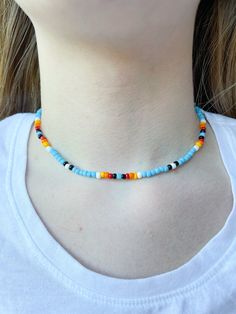 This beautiful and colorful necklace has already become a staple accessory in my jewelry collection! I love the gradient of colors, it really reminds me of a beautiful morning sunrise. This necklace is 16 inches long and made with durable stretchy string! Handmade Light Blue Necklaces For Summer, Handmade Light Blue Necklace For Summer, Blue Beaded Necklaces For Jewelry Making In Summer, Blue Round Beads Necklaces For Summer, Handmade Light Blue Beaded Necklace For Summer, Casual Turquoise Necklace With Tiny Beads, Bohemian Rainbow Choker Necklace, Casual Blue Choker With Colorful Beads, Casual Light Blue Jewelry With Colorful Beads