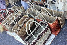 baskets are lined up on the ground for sale