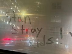 graffiti written on the window of a building