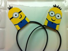 a pair of yellow and blue ears made to look like cartoon characters