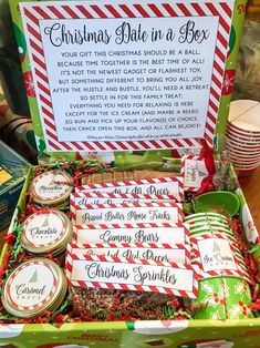 a box filled with lots of christmas treats and candy canes on top of a table