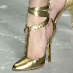 Chic Gold Ankle Wrap Heels, Gold Chic Ankle-wrap Heels, Gold T-strap Leather Heels, Gold Leather T-strap Heels, Gold T-strap Heels For Party, Designer T-strap Heels For Party, Luxury T-strap Heels For Party, Bronze Heels, Pencil Heels