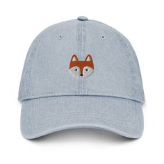 a blue hat with a red fox embroidered on the front