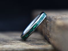 This amazing women's ring features a green malachite stone inlay in a narrow titanium band for a clean, modern look. Wear it alone, or stack it with other rings for an even more unique look! Every Richter Scale ring is covered by our 100% lifetime guarantee Typically ships within weeks, not months like some! About This Ring- Resizing- This ring can be resized up or down as much as 1 full size (See policies for details) Materials- Titanium, Malachite stone inlay Finish- Polished Care Instructions Richter Scale, Titanium Wedding Band, Green Malachite, Malachite Stone, Big Rings, Stone Inlay, Detailed Ring, Diy Rings, Titanium Rings