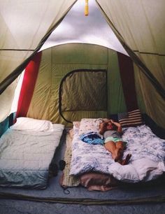 a person laying in a bed inside of a tent with the caption, this just looks perfect