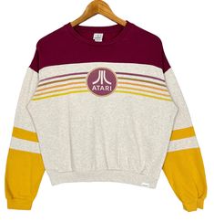 Atari Japanese Game Company Big Logo Striped Crewneck Sweatshirt Women Multicolored Size Small * Made in : China * Size on Tag : S * Manual Measurement (inch) : Chest 22, Length 21.5, Shoulder 23.5, Sleeve 20. * Recommended for Size : Small (S) * Colour : Brown / Maroon / Yellow * Condition : Good * See photos for details. * Free Defect : No Stain, No Holes, No Tears, No Faded. 76 Retro Crew Neck Tops For Fall, Retro Contrast Color Tops For Fall, Retro Color Block Tops For Fall, Retro Crew Neck Tops With Contrast Color, Crew Neck Cotton Sweater With Contrast Color, Retro Fall Color Block Tops, Cotton Crew Neck Sweater With Contrast Color, Multicolor Cotton Tops With Ribbed Cuffs, Retro Long Sleeve Top With Contrast Color