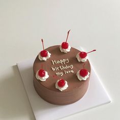 a chocolate birthday cake with cherries and the words happy birthday my love written on it