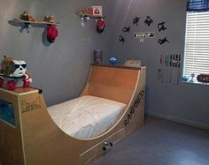 a child's bedroom with a skateboard ramp