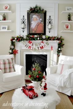 a living room decorated for christmas with white furniture