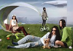 three women sitting on the grass with their dogs and an airplane in the sky behind them