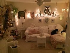 a living room filled with furniture and christmas lights