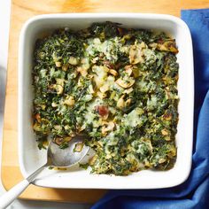 a casserole dish with broccoli and nuts in it