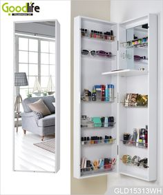 an open medicine cabinet next to a mirror