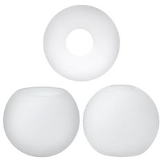 three white round objects on a white background