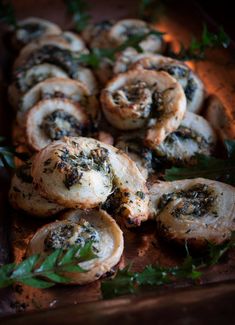 small pastries with herbs and seasoning on a wooden tray, ready to be eaten