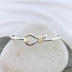 The simple design of the Sandbar Hook Bracelet features a single band, the same width of the single ball Cape Cod bracelet. It is beautifully accented with the classic 14k gold ball and gold bar wrap.  Crafted by a local artist, each piece may vary slightly in design as each is handmade and unique.  MEASURE TO FIND YOU Cheap Casual Jewelry With Adjustable Band, Cheap Metal Bracelet Jewelry, Affordable Metal Bracelet, Cape Cod Bracelet, Handmade Copper Bracelet, Starfish Bracelet, Hook Bracelet, Bracelets Silver, Gold Link Bracelet