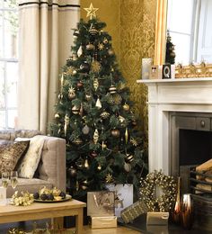 a living room with a christmas tree in the corner and presents on the coffee table