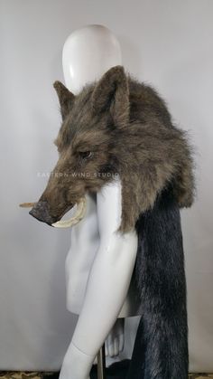 an animal's head is shown on top of a mannequin