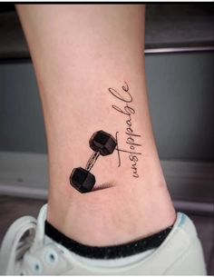 a woman's foot with a tattoo that says, i love my dumbbells