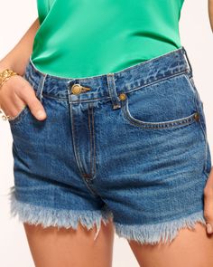 No spring wardrobe is complete without a pair of denim shorts, and the Juniper shorts are at the top of our list. The high-waist was made for seamless tucking, while the distressed hemline on this short style lends a contemporary touch sure to enhance your look. Size & Fit – Fits true to size, take your normal size – Model is Wearing Size 25 – Model is 5'9" Size Guide Details & Care – 100% Cotton – High-waisted – Pockets – Button closure with zipper – Distressed hem– Dry Clean or Hand Wash– Styl Chic High-waisted Jean Shorts With Frayed Hem, Chic Shorts With Frayed Hem, Chic Short Bottoms With Frayed Hem, Chic Jean Shorts With Built-in Shorts, Chic Short Length Jeans For Summer, Chic Cutoff Cotton Jean Shorts, Chic Cotton Cutoff Jean Shorts, Spring High-waisted Dark Wash Jean Shorts, Chic Bottoms With Frayed Hem And Short Length