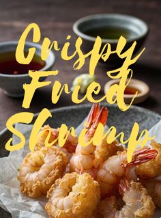 fried shrimp on a plate with dipping sauces in the background and text overlay that reads crispy fried shrimp